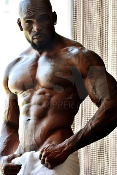 Black male stripper Swagg in a hotel room waering a towel