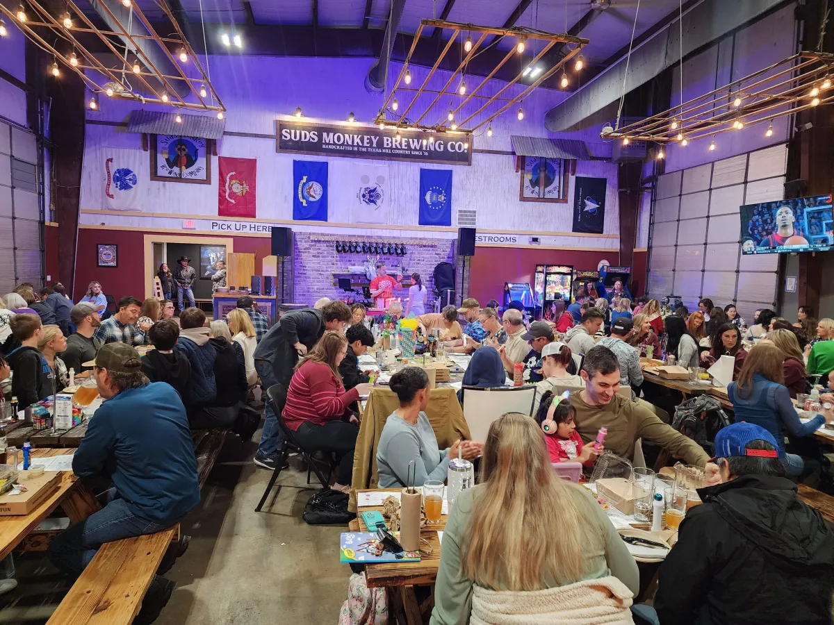 two person standing on gray tile paving