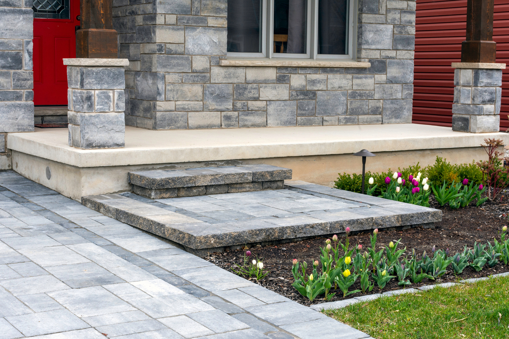 Luxurious hardscaping with stones on steps on in home backyard