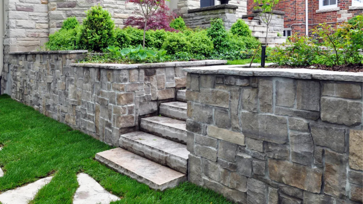 New hardscape wall and stairs in yard