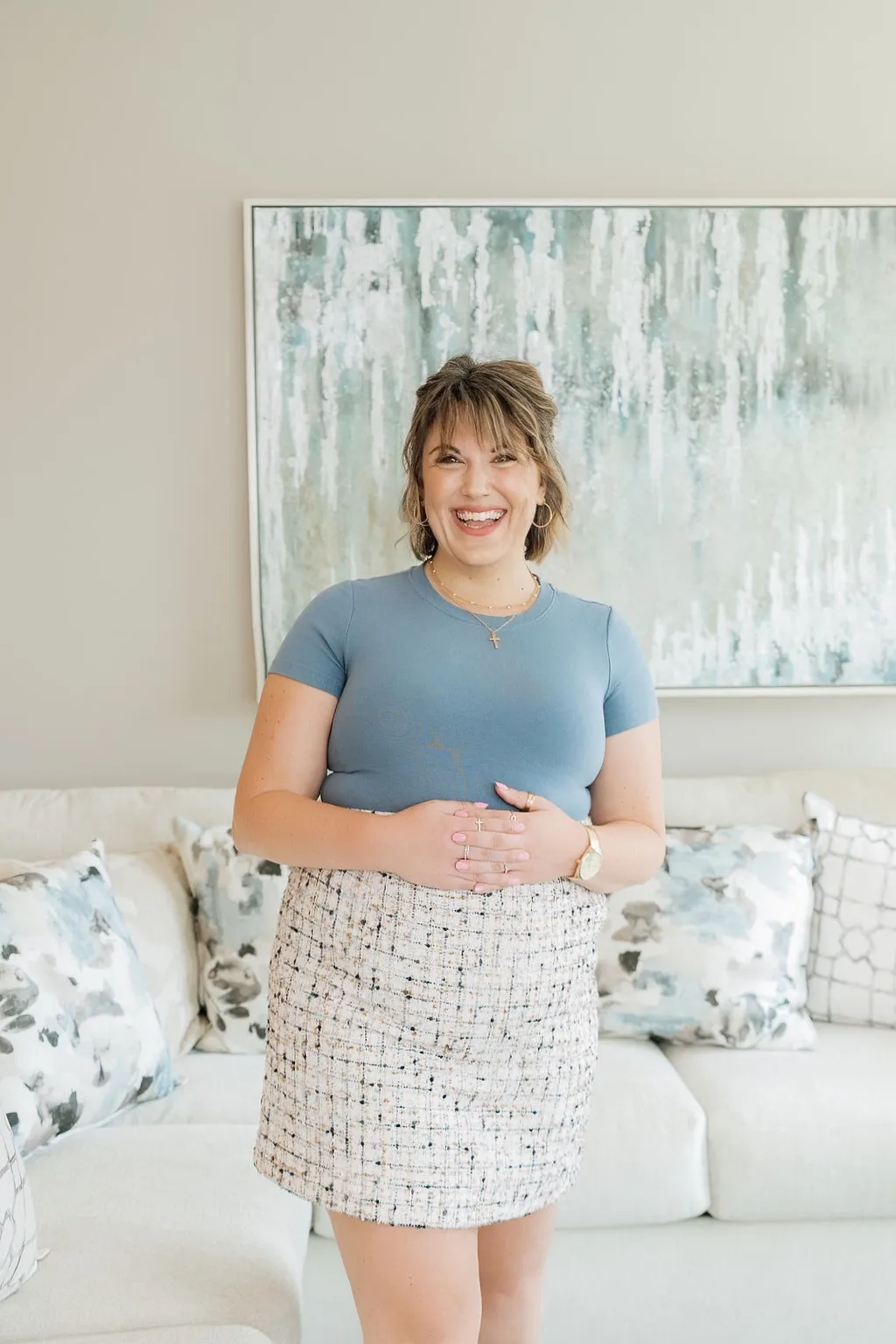 Alishia Nugent, founder of Valarity, smiling in a bright living room