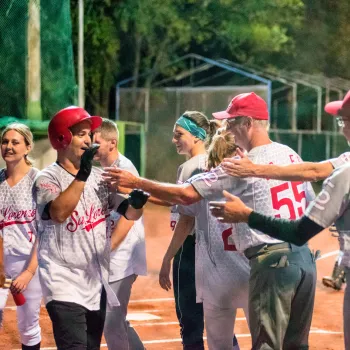 Community members participating in softball games