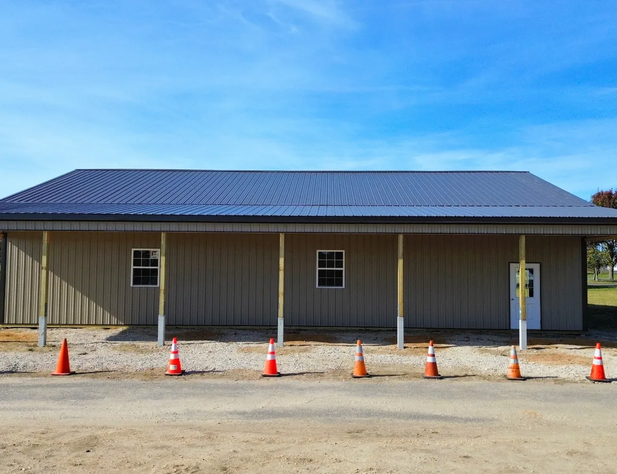 Post-frame building with a full-length covered porch