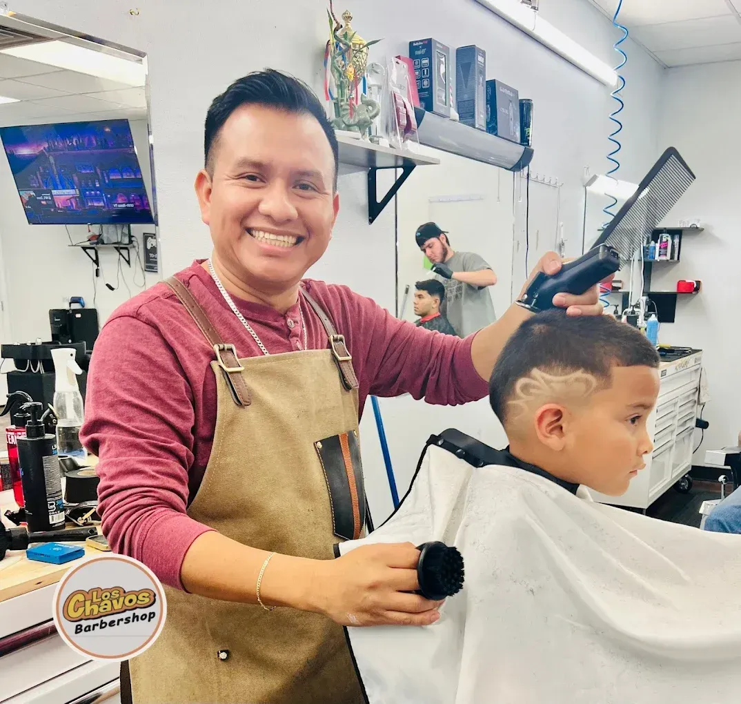 Owners Jesse and Tito inside Los Chavos Barbershop