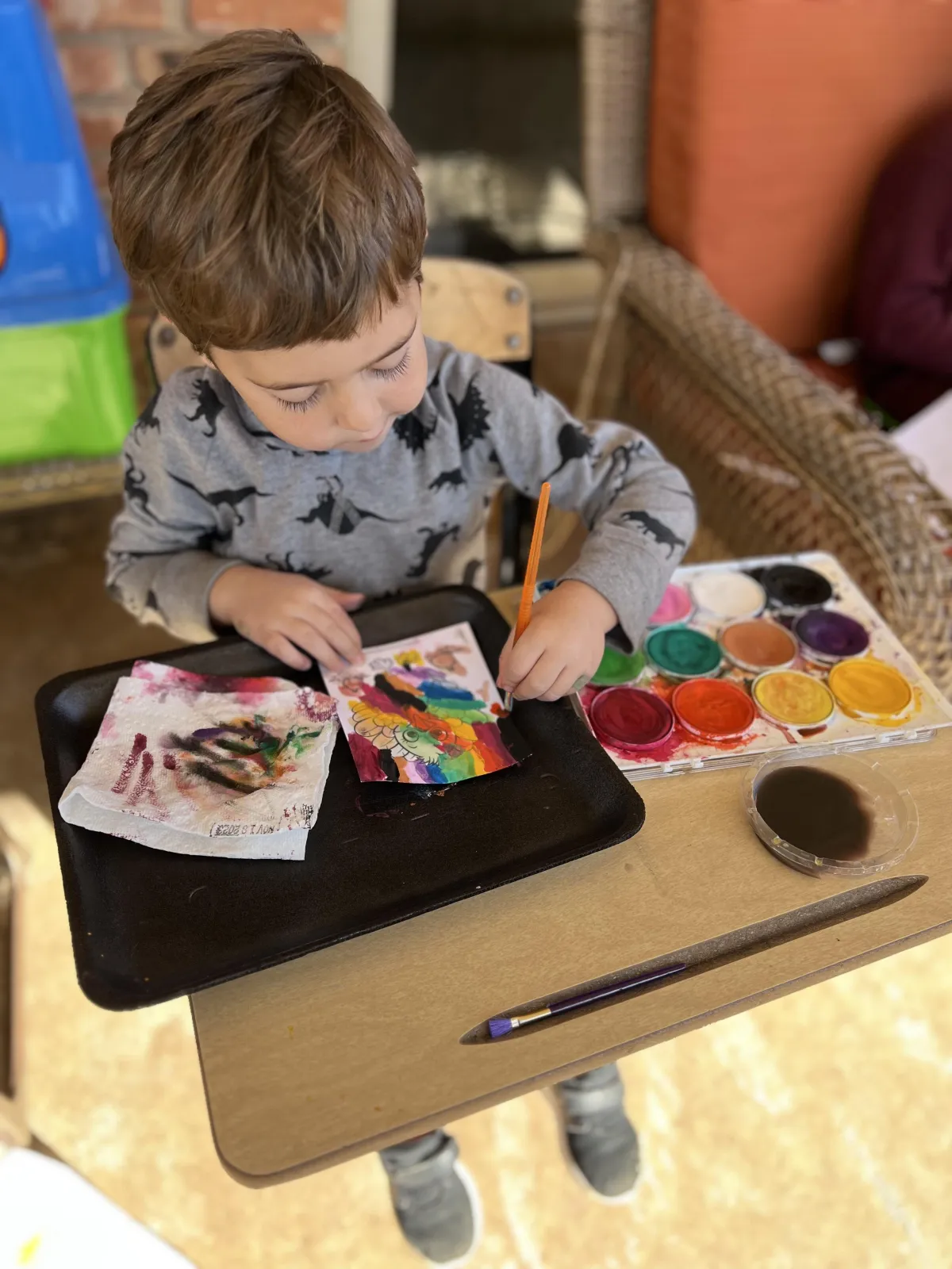 Girl follows directions during arts and crafts time.
