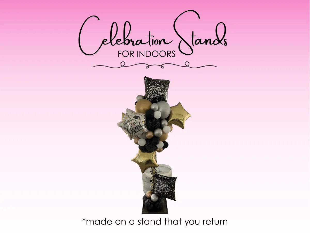 Graduation balloon stand with black and gold balloons