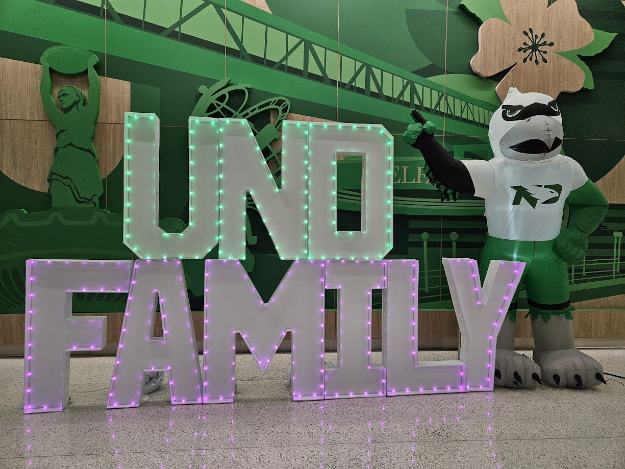 Light-up UNDFamily marquee letters display for event backdrop