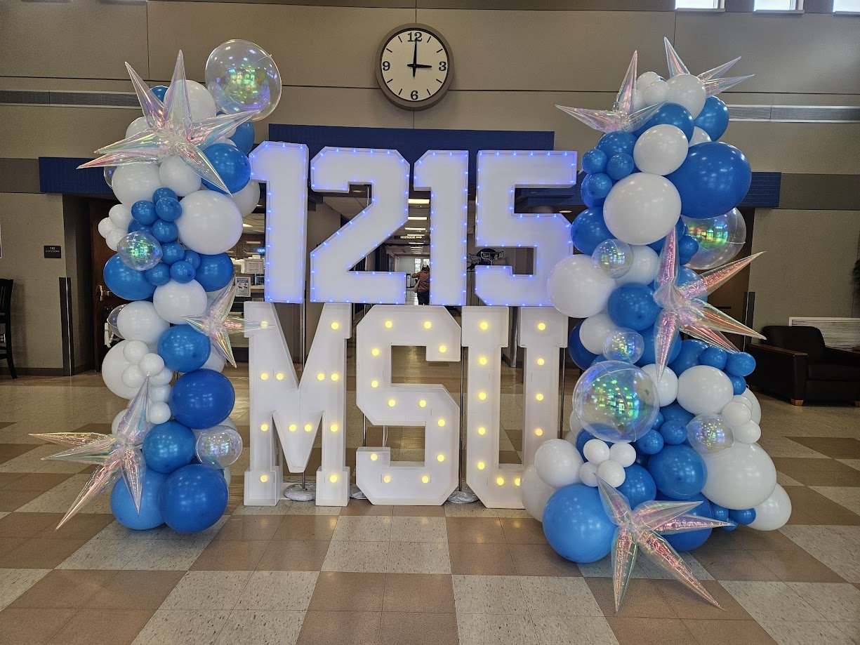 Graduation balloon backdrop with light-up 2025 numbers and marquee letters