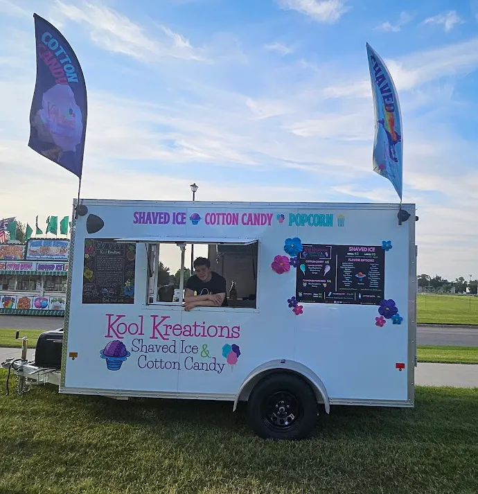 Shaved ice and cotton candy trailer at outdoor event