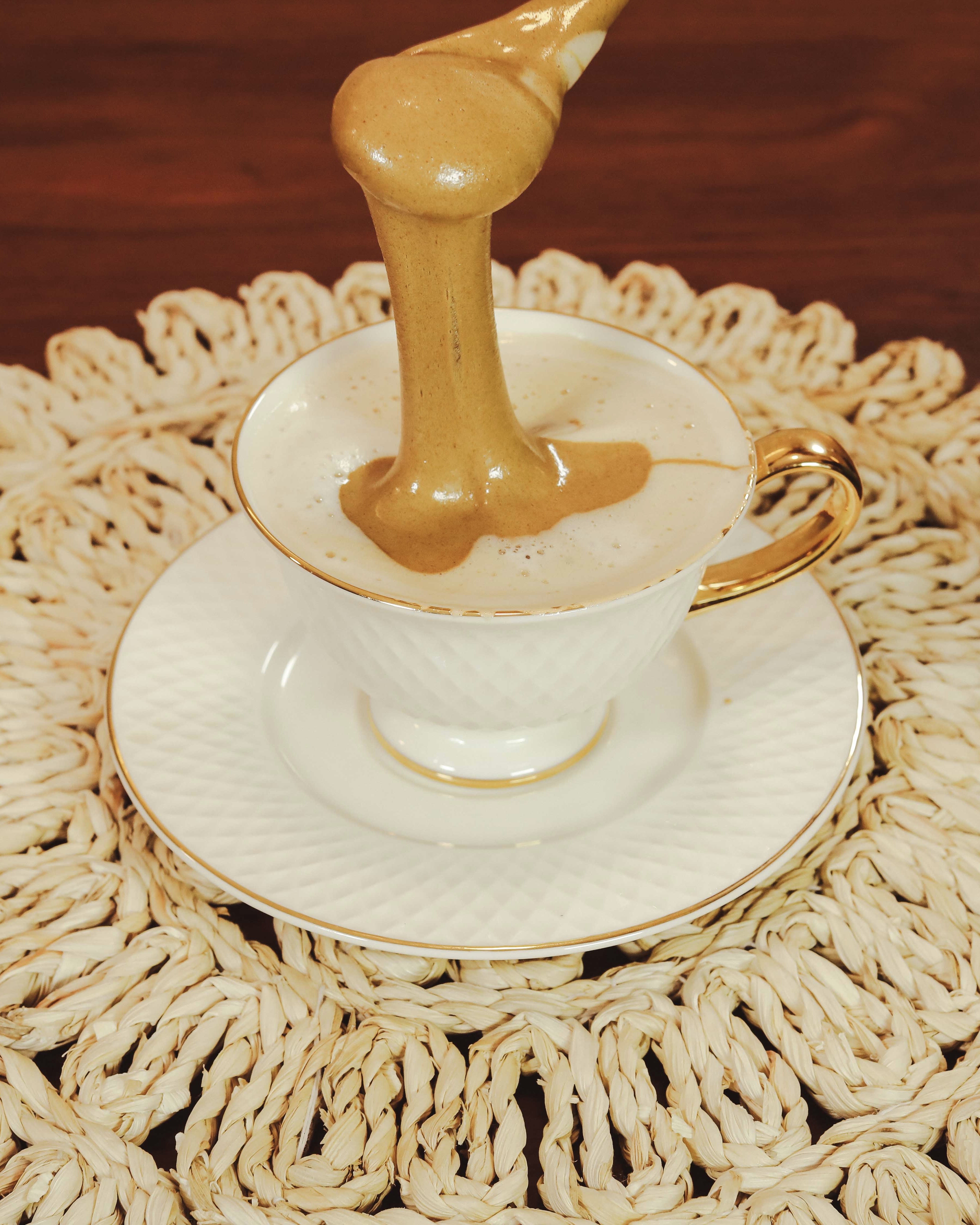 white and gold round plate on table