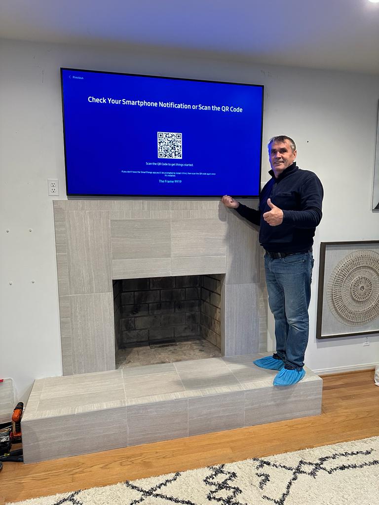 TV mounted above fireplace in Vienna VA
