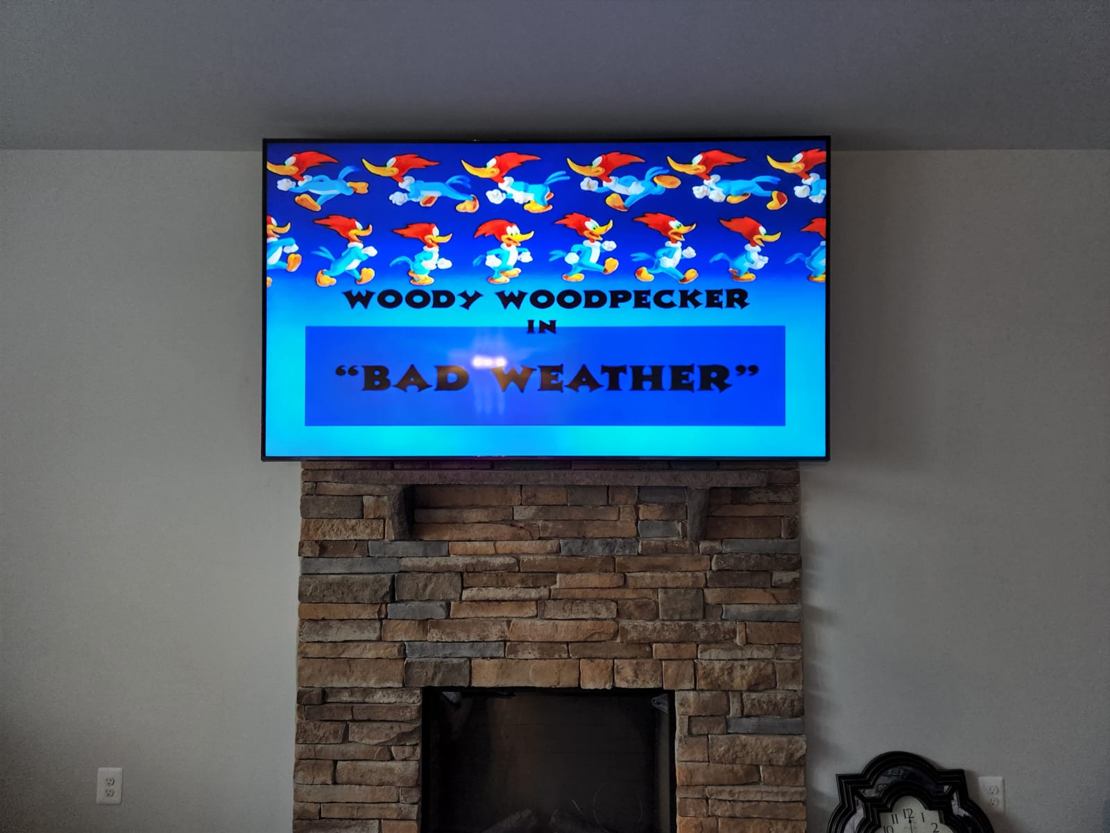 TV mounted above fireplace in Tysons Virginia