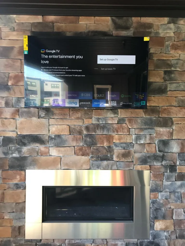 TV mounted above fireplace in Herndon Virginia