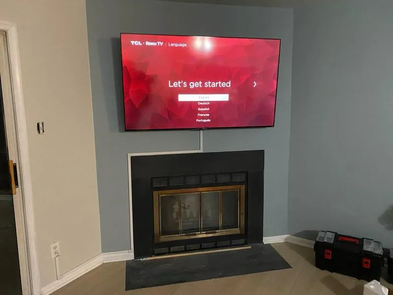 TV mounted above fireplace in Kingstowne Virginia
