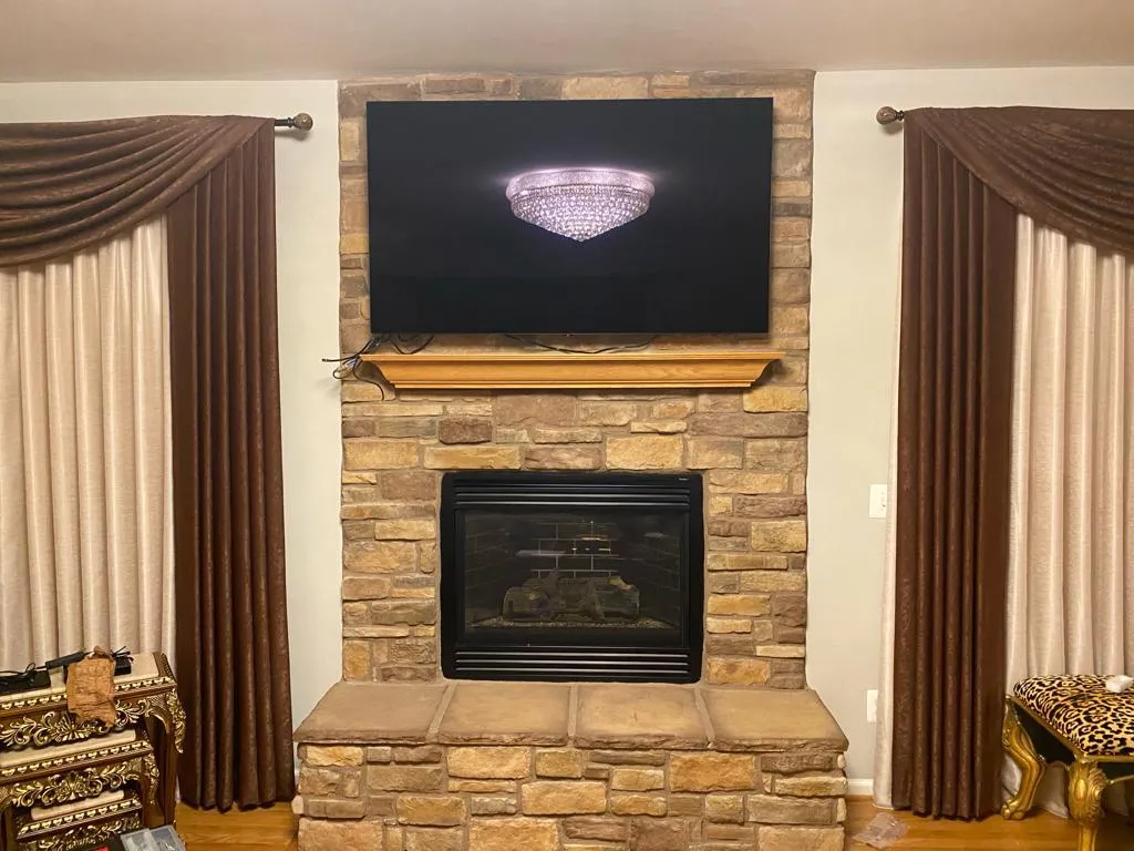 TV mounted above fireplace in Aquia Virginia