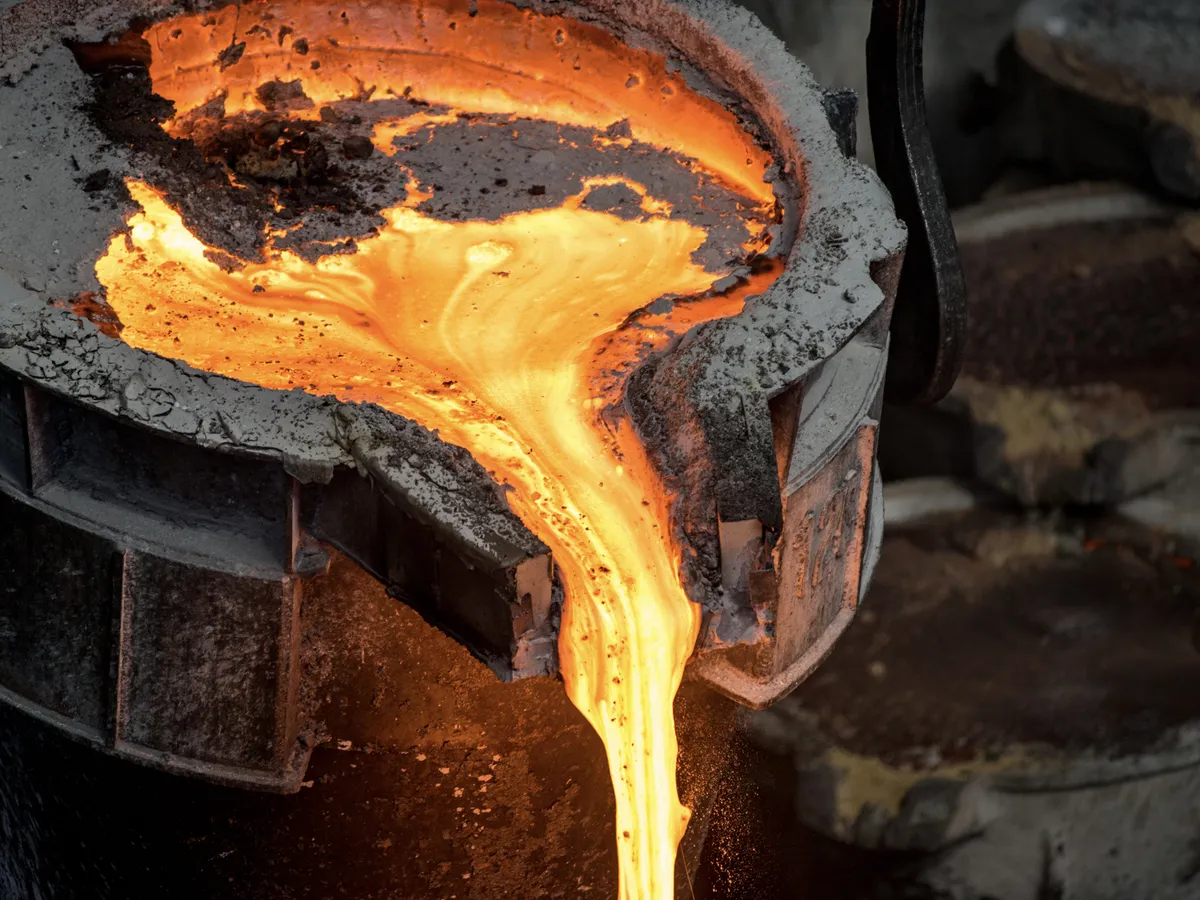 Molten metal being poured at industrial foundry