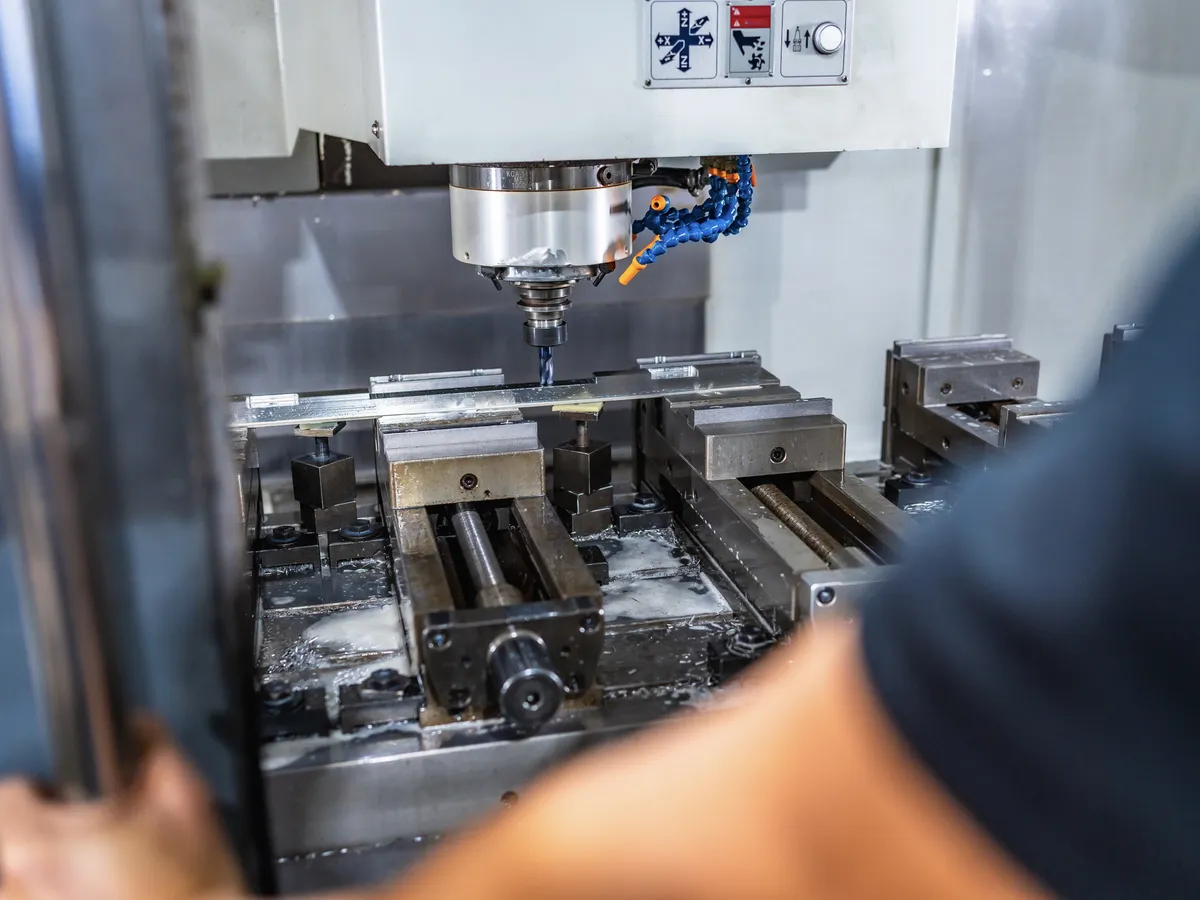 Automated metal milling machine in a manufacturing facility