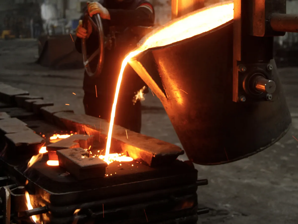 Molten metal pouring at foundry at night