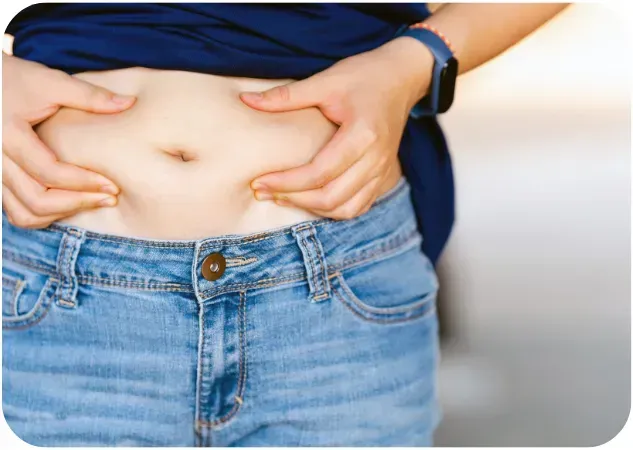 woman showing belly fat