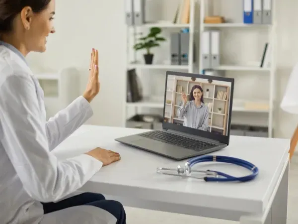 Doctor providing a personalized GLP-1 prescription through a video consultation.