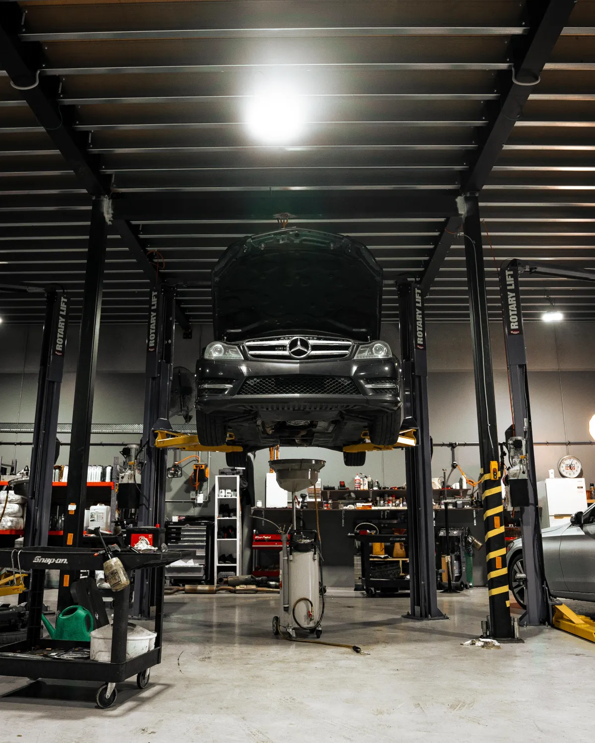 Mechanic performing logbook service on Mercedes-Benz at StarTech Prestige Cranbourne West.