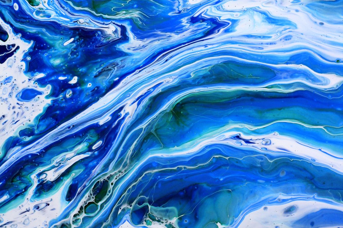 Blue and silver metallic epoxy floor swirl pattern in Ocala, Florida