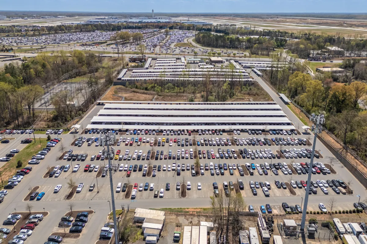 Parkimo shared fleet depot with vehicle parking, staging, and charging infrastructure