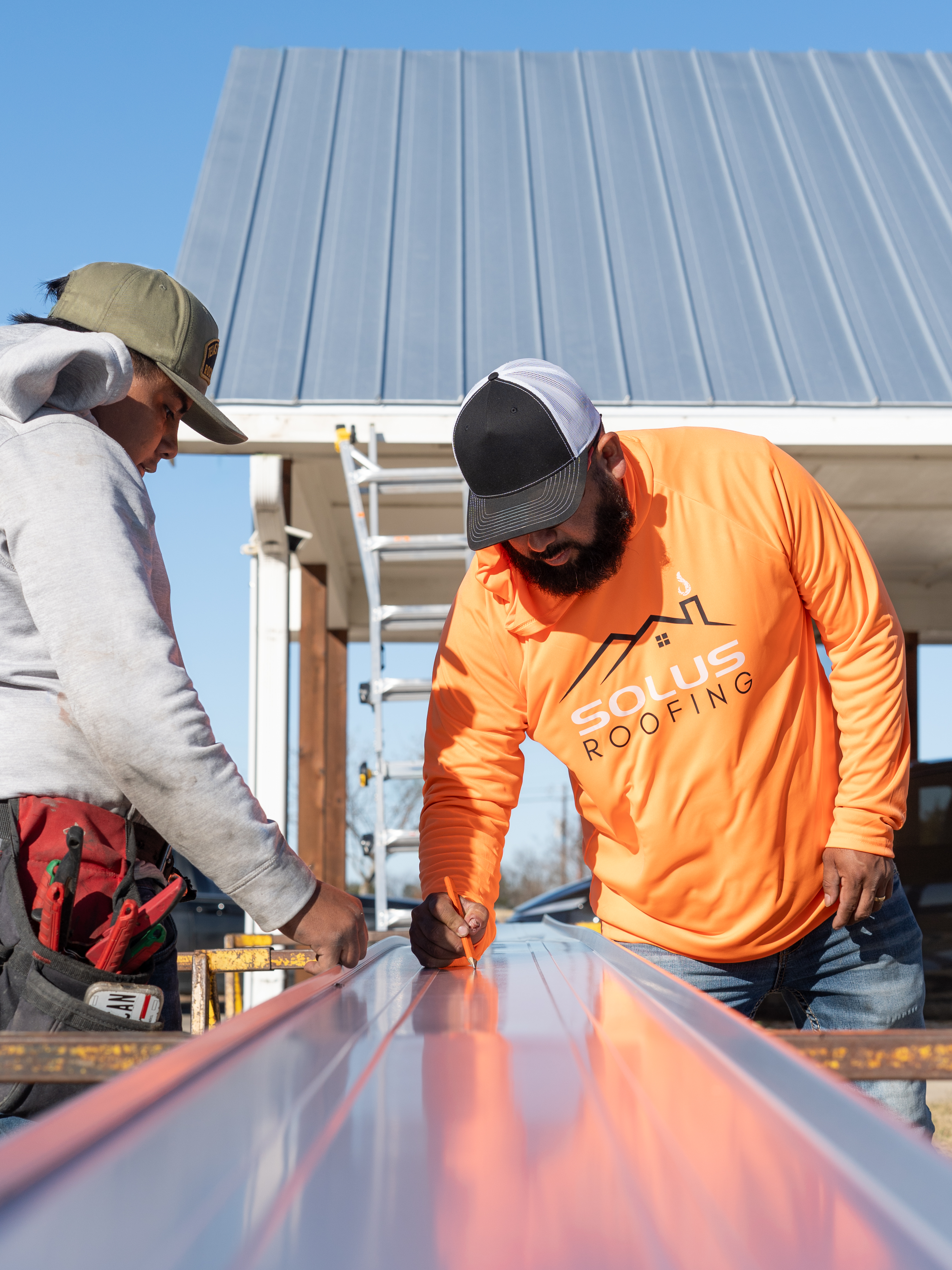 Solus Roofing team performing a professional roof repair in Sherman, TX