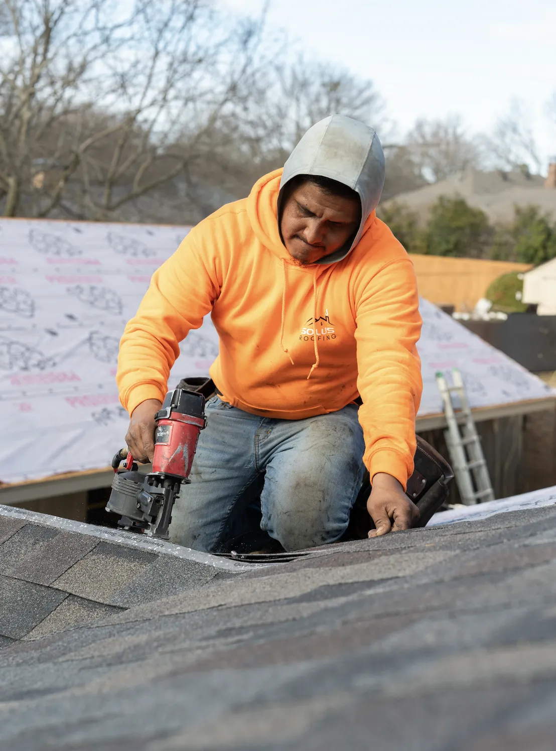 Solus Roofing team repairing a shingle roof in Sherman, TX