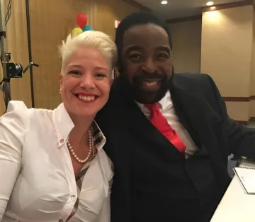 Brigitta Hoeferle and Les Brown co-speaking at a premier leadership and personal development event. Aligning voices of transformation, legacy, and global impact