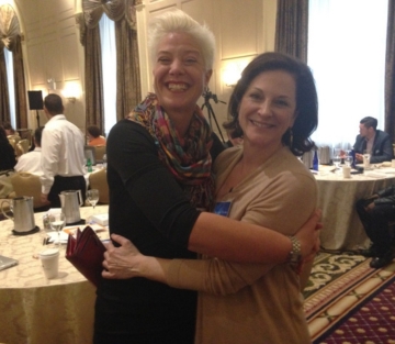 Brigitta Hoeferle with Karen Leland: connecting at a high-level branding and business leadership event focused on reputation, visibility, and market authority.