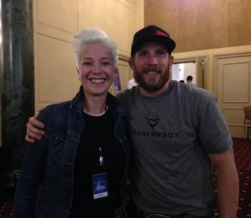 Brigitta Hoeferle with the Iron Cowboy James Lawrence - aligned at a high-performance mindset and leadership event focused on resilience, endurance, and unstoppable execution.