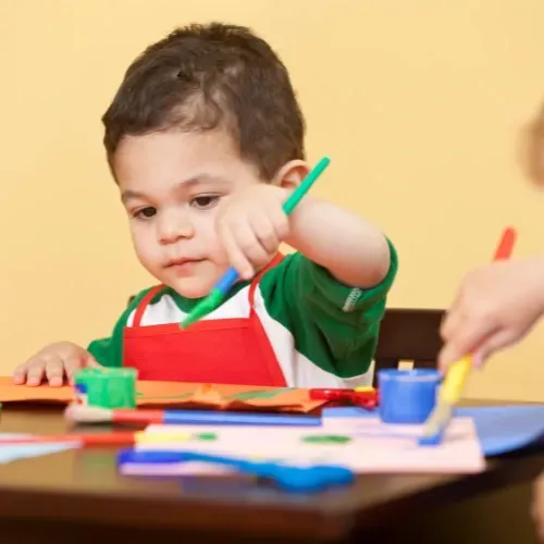 Children engaged in play-based learning at Learn & Play Child Center, exploring The Creative Curriculum® activities.