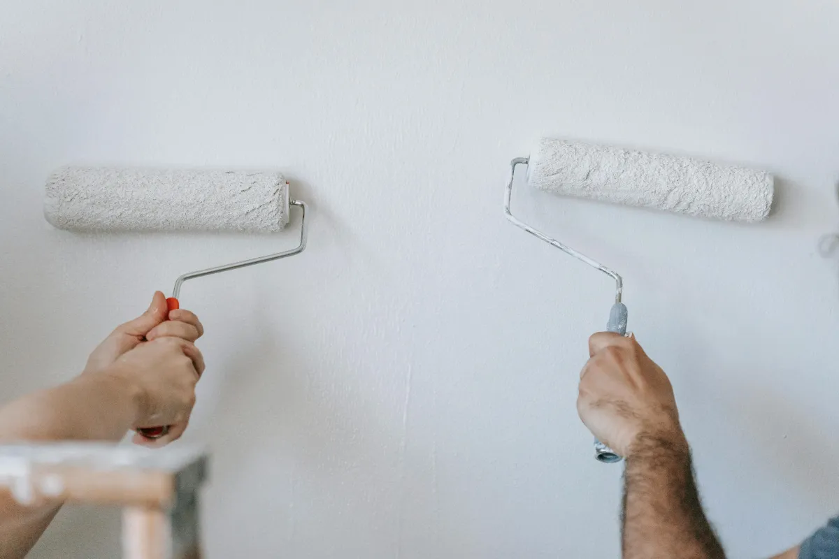 Professional house painters working on an exterior home in Long Island.