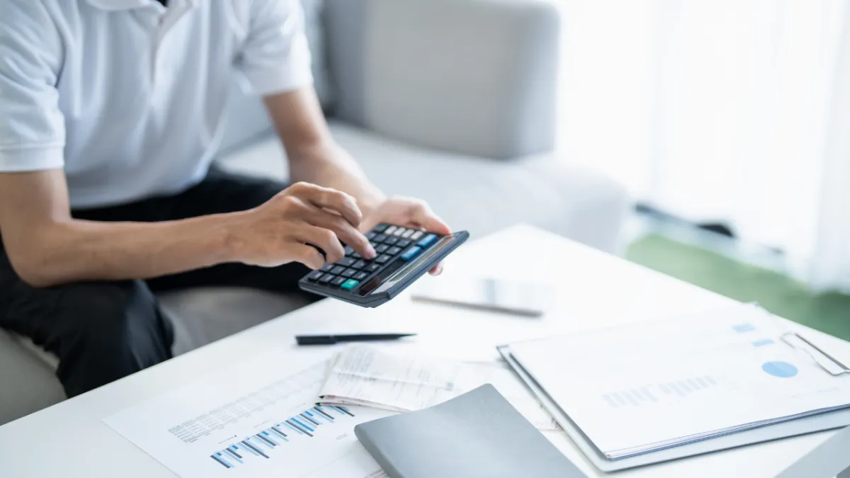 Homebuyer reviewing mortgage costs in Pensacola Florida with homes in Pace and Gulf Breeze
