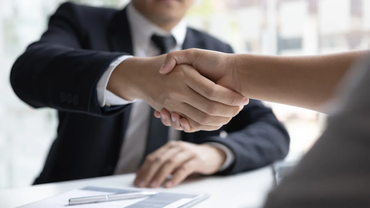 Home seller reviewing multiple offers in Pensacola Florida real estate market