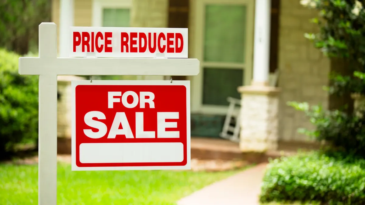 Pensacola Florida home listing with price reduction sign and active buyer market