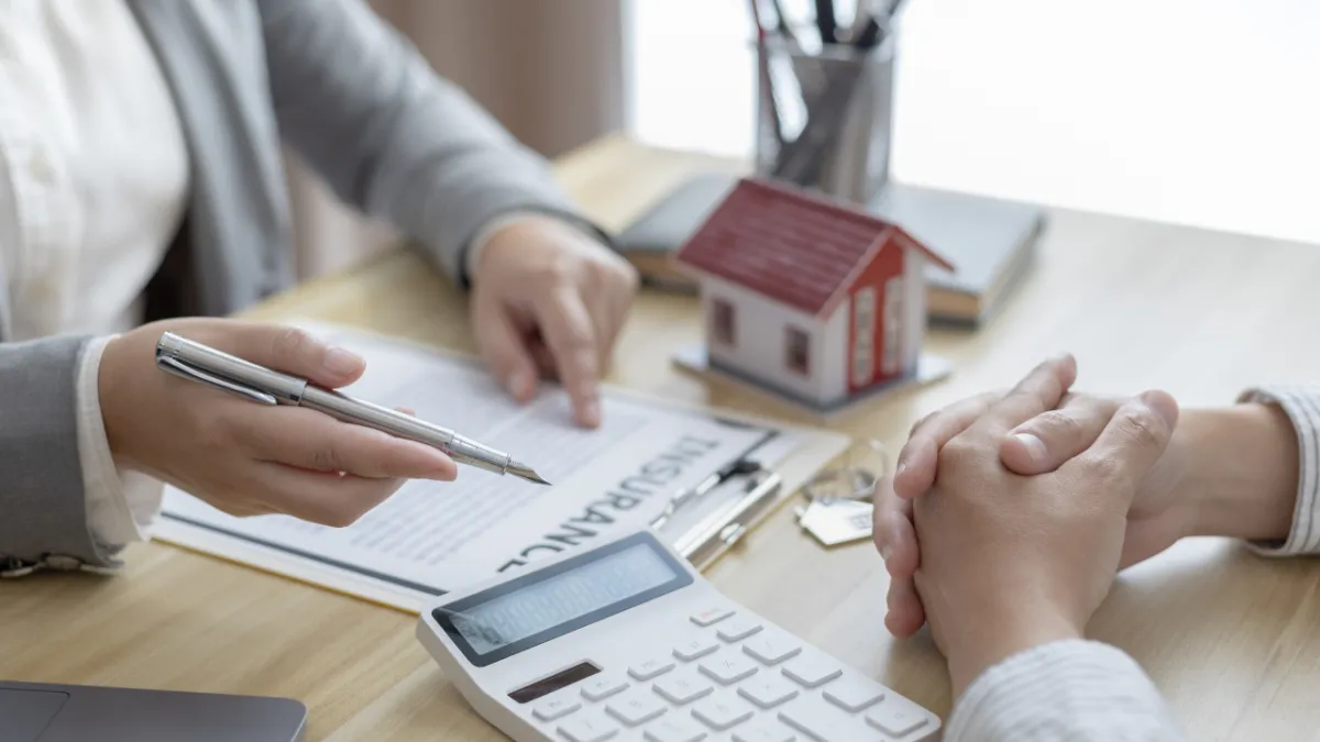 Real estate agent reviewing home pricing strategy for a Pensacola home sale