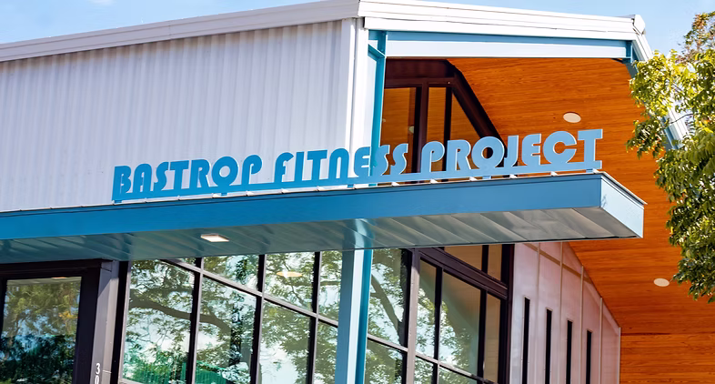 Exterior of the Bastrop Fitness Project building, home of Wild Child and other local wellness businesses