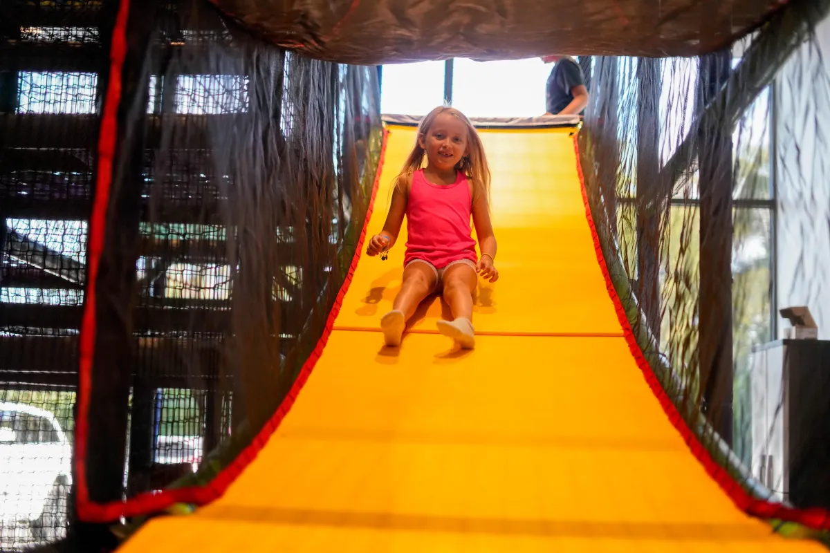 Kids playing together at Parents Night Out inside Wild Child indoor playground in Bastrop, TX