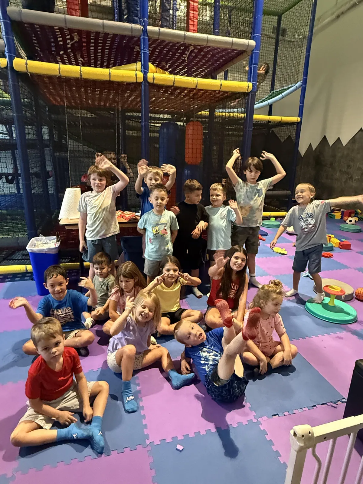 Group of happy children participating in a fitness class at Camp Wild Strive in Bastrop, TX.