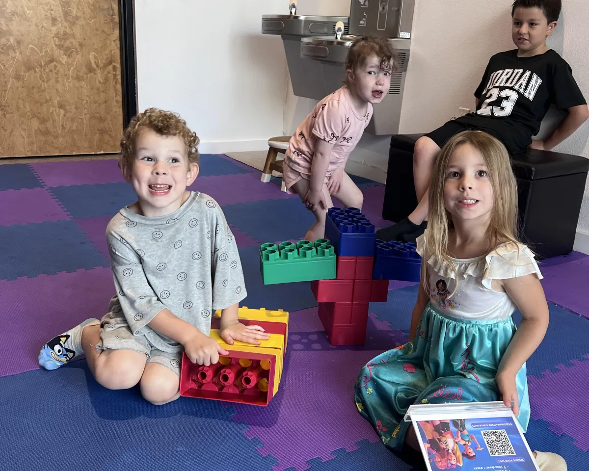 Children learning beginner Spanish through songs and games at Wild Child Bastrop’s Spanish 101 class.