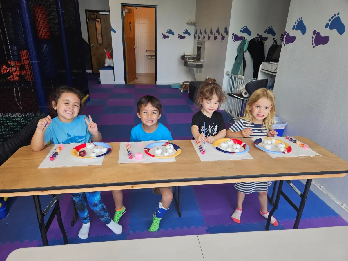 Kids painting and creating crafts during Arts Club at Wild Child Bastrop.