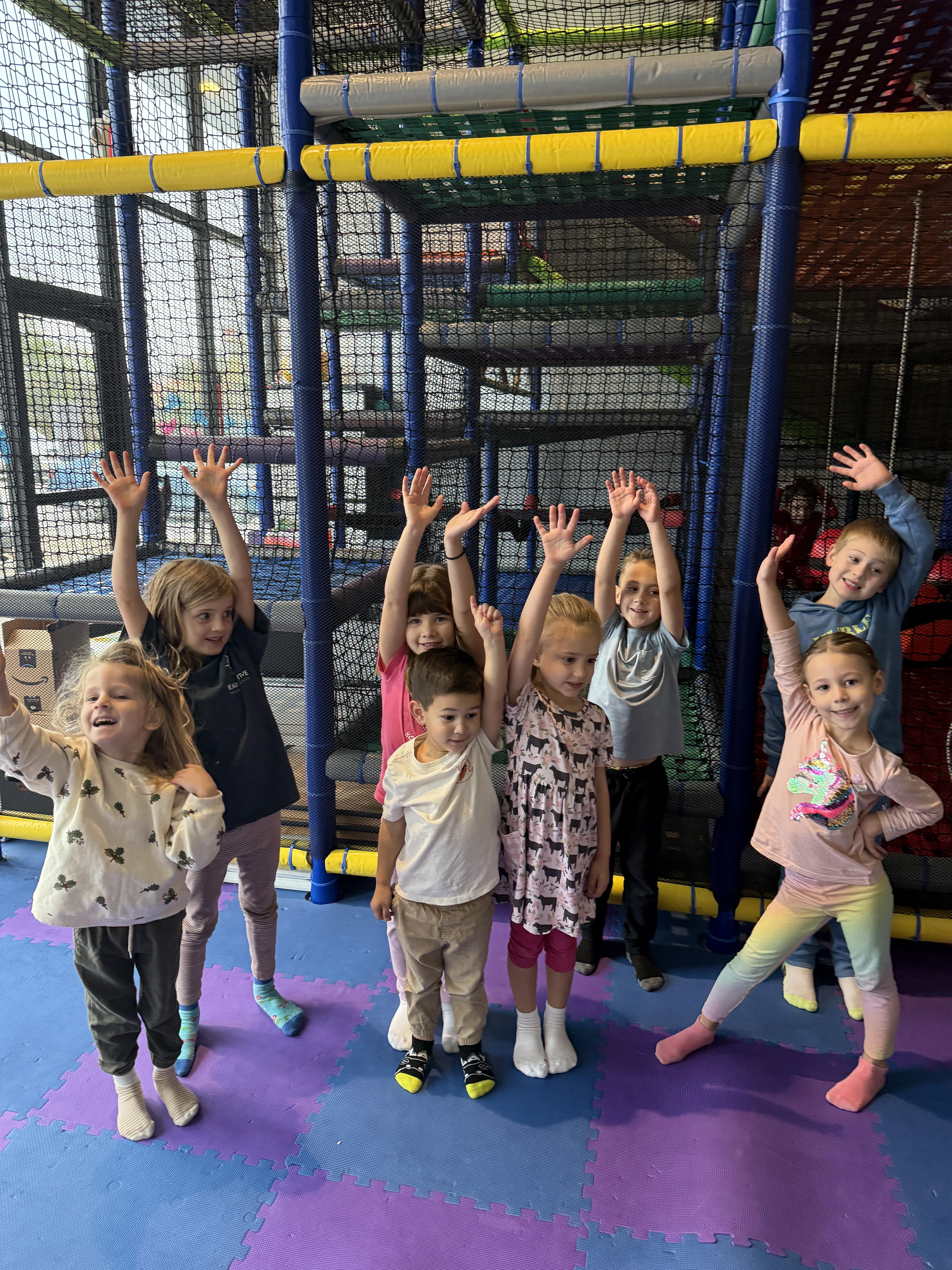 Group of happy children participating in a fitness class at Camp Wild Strive in Bastrop, TX.
