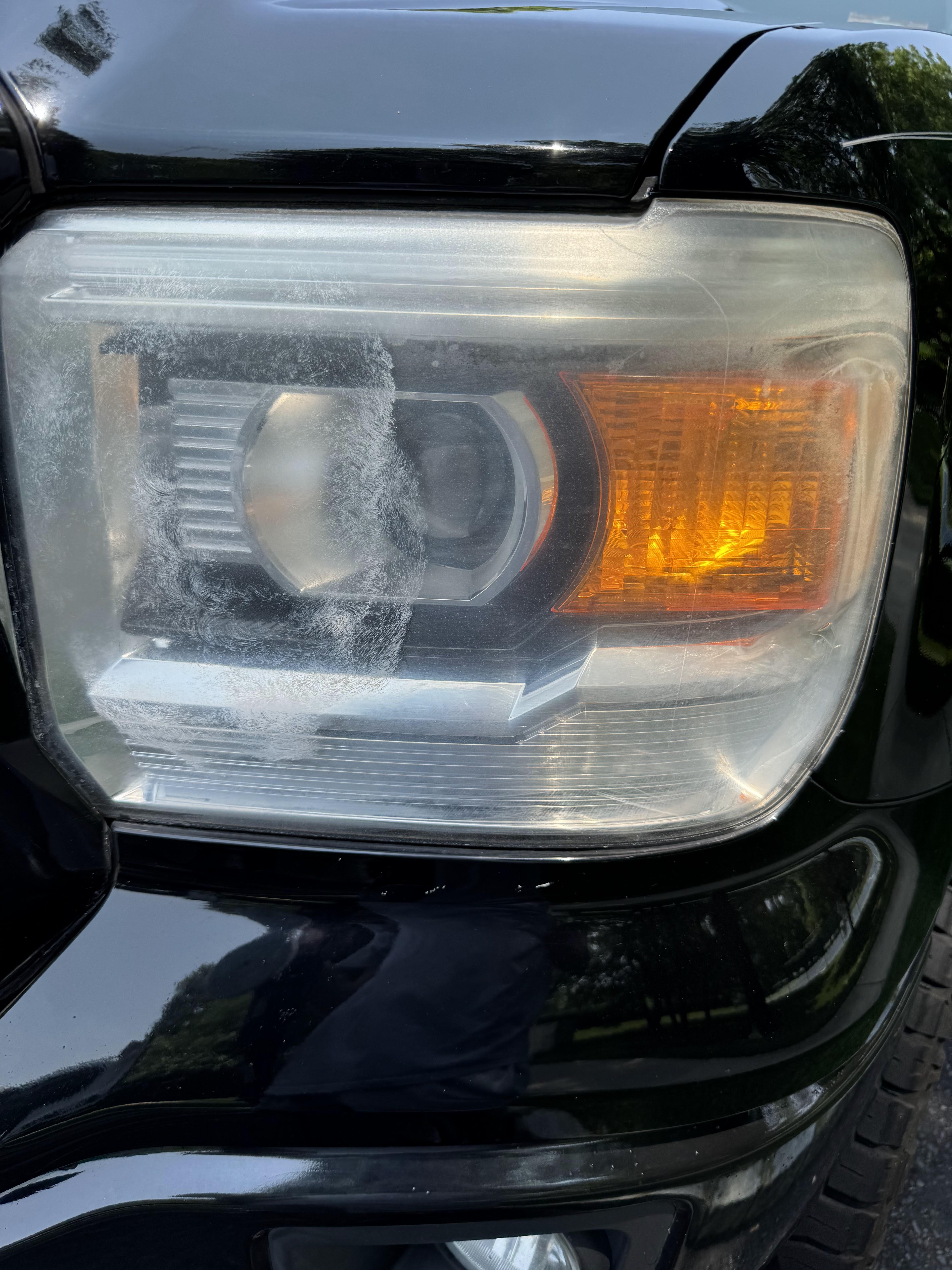 Before headlight restoration showing oxidation and yellowing on a pickup truck in South Jersey.