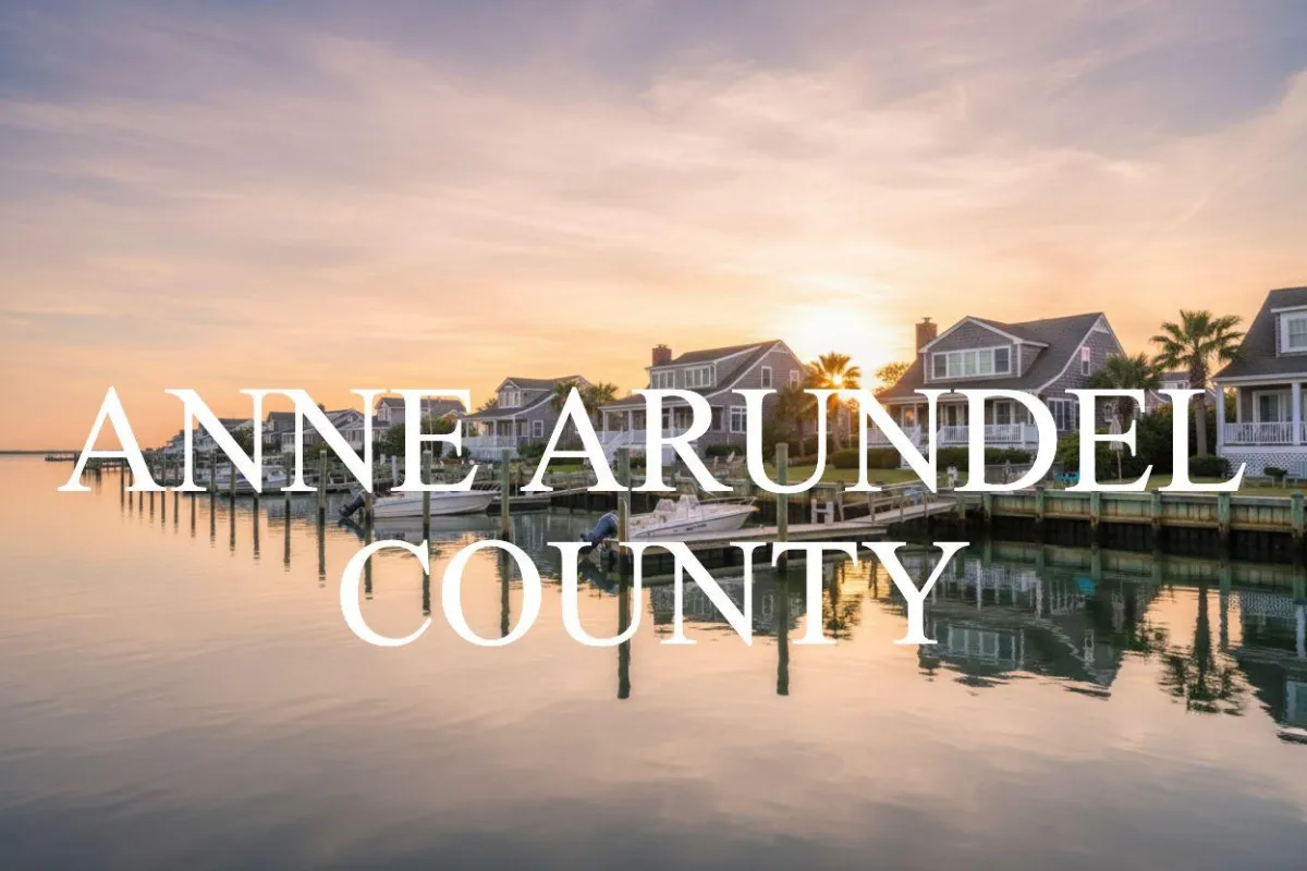 Harbor-front shot for Anne Arundel: calm water, piers and coastal homes at golden hour; atmospheric composition evokes lifestyle benefits of the neighborhood.