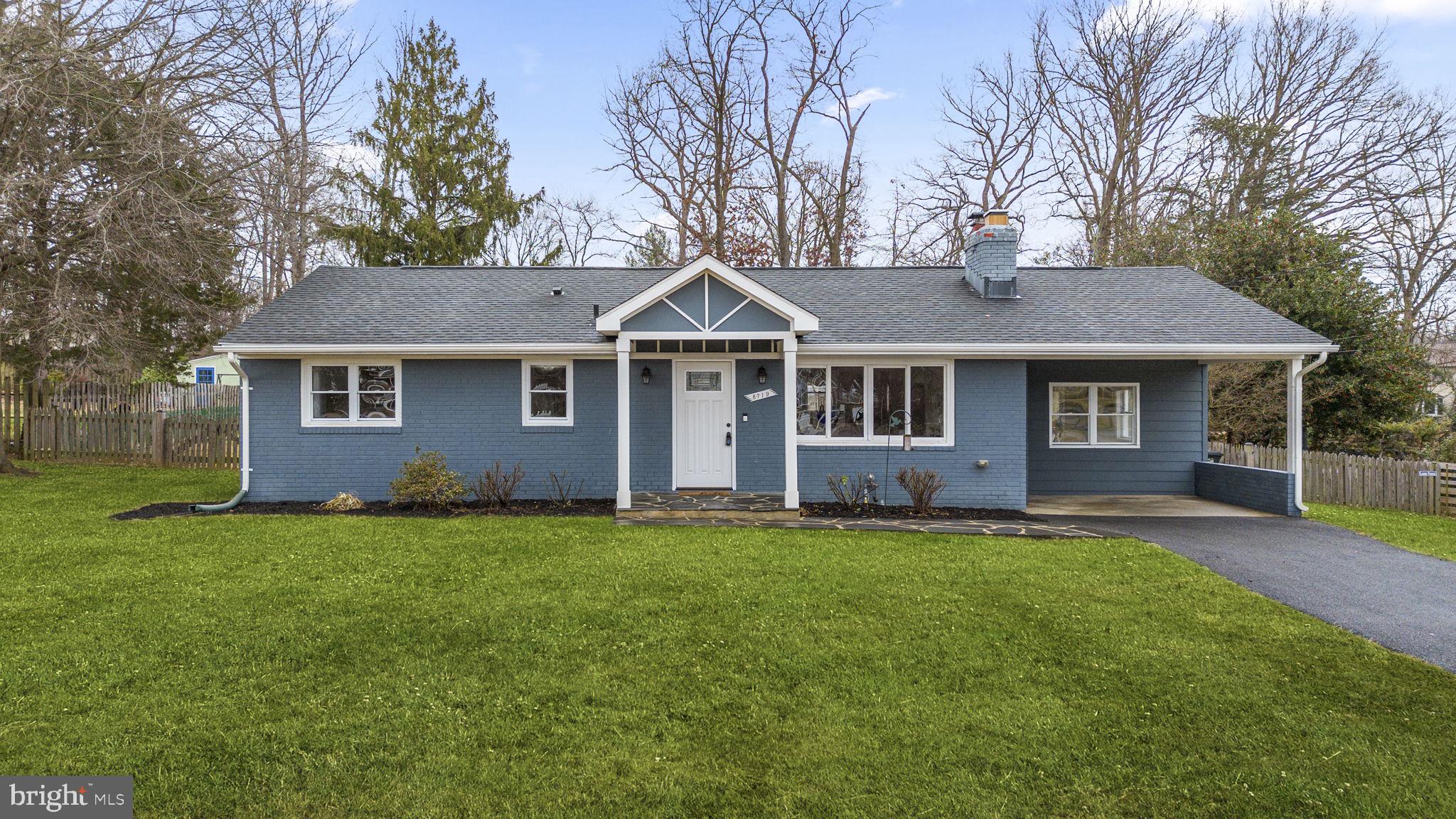 Harbor-front shot for Anne Arundel: calm water, piers and coastal homes at golden hour; atmospheric composition evokes lifestyle benefits of the neighborhood.