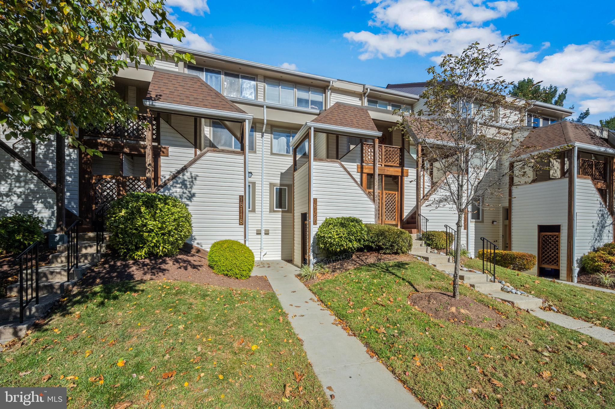 Harbor-front shot for Anne Arundel: calm water, piers and coastal homes at golden hour; atmospheric composition evokes lifestyle benefits of the neighborhood.