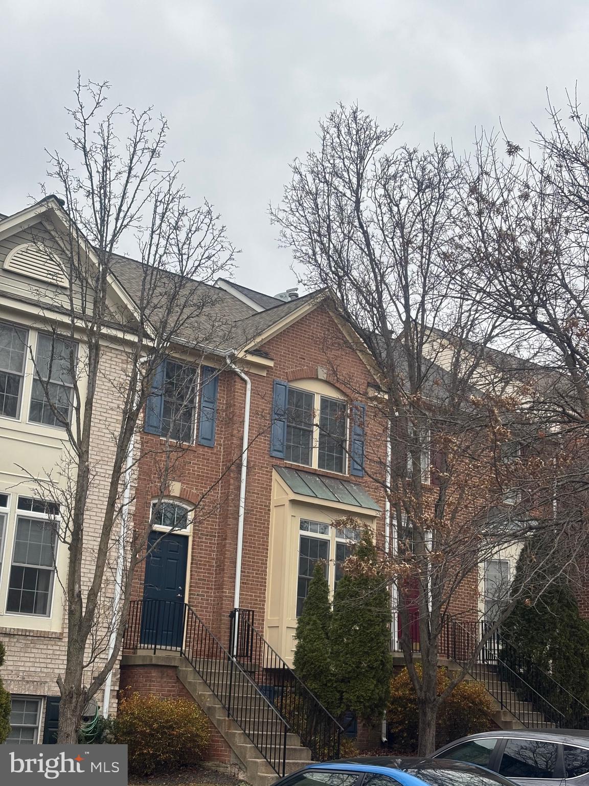 Harbor-front shot for Anne Arundel: calm water, piers and coastal homes at golden hour; atmospheric composition evokes lifestyle benefits of the neighborhood.