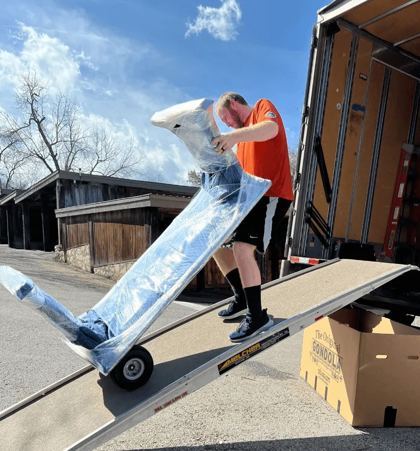 male loading table to back of moving truck